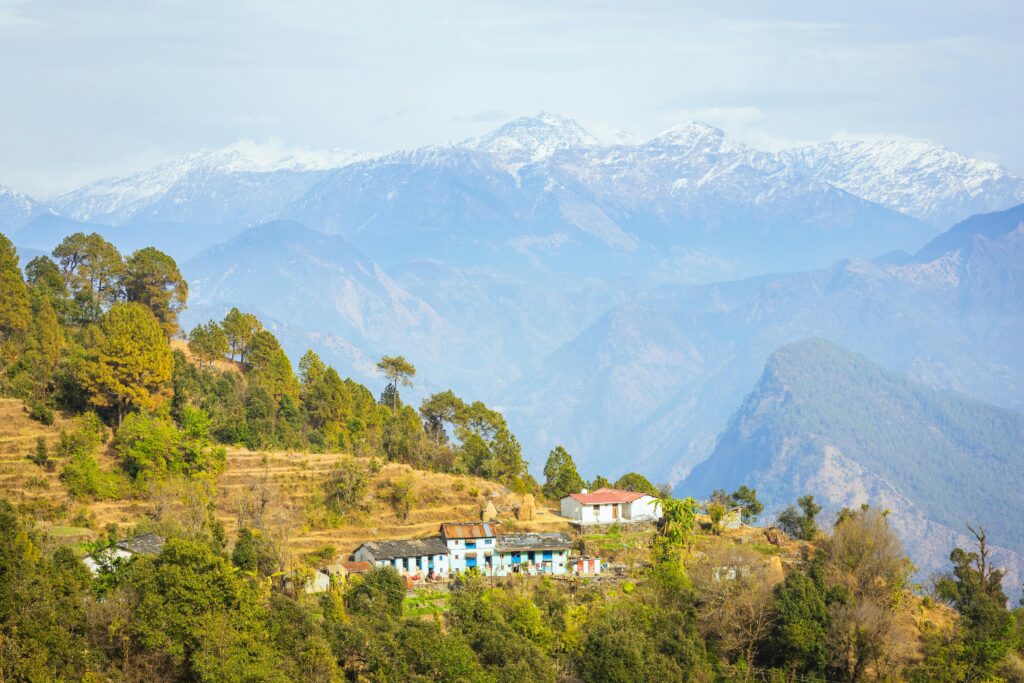 Remote mountain village with Himalayan backdrop in Kumaon Uttarakhand